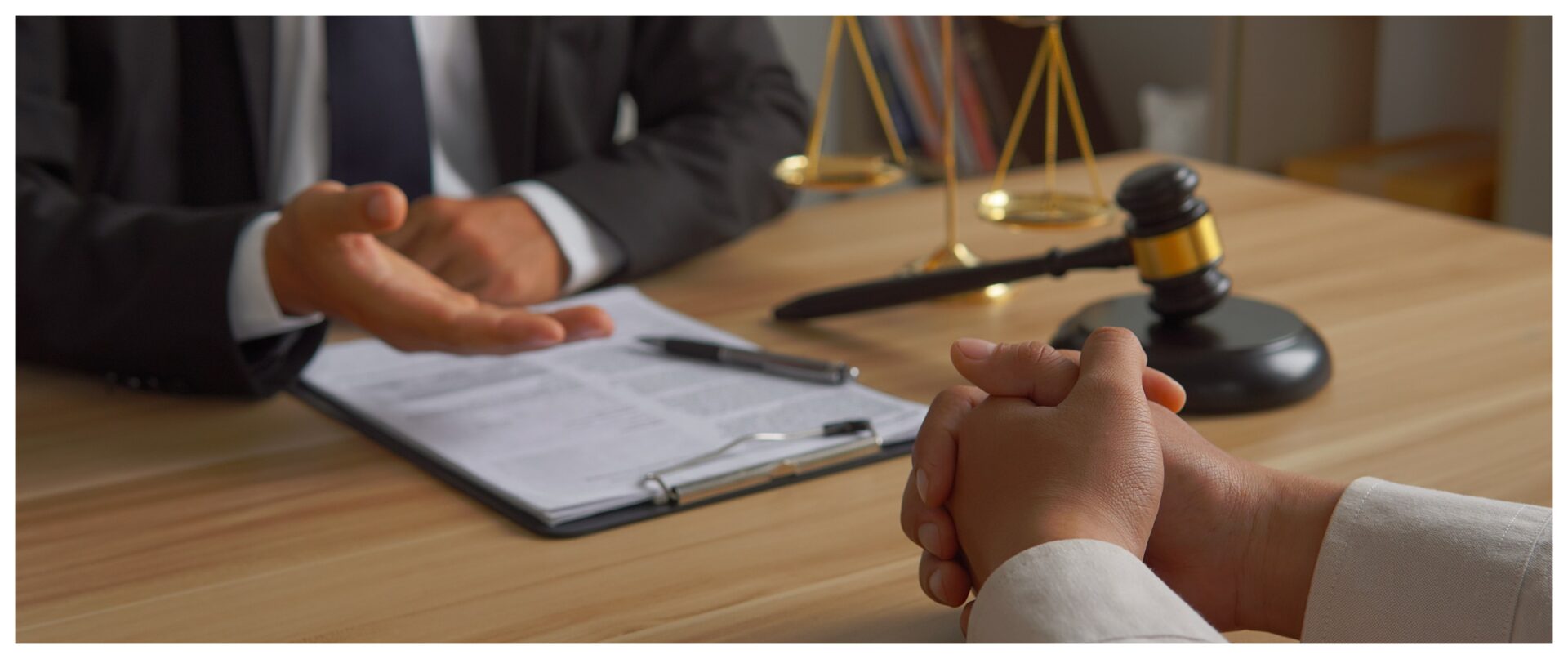 Legal consultation with gavel and scales.